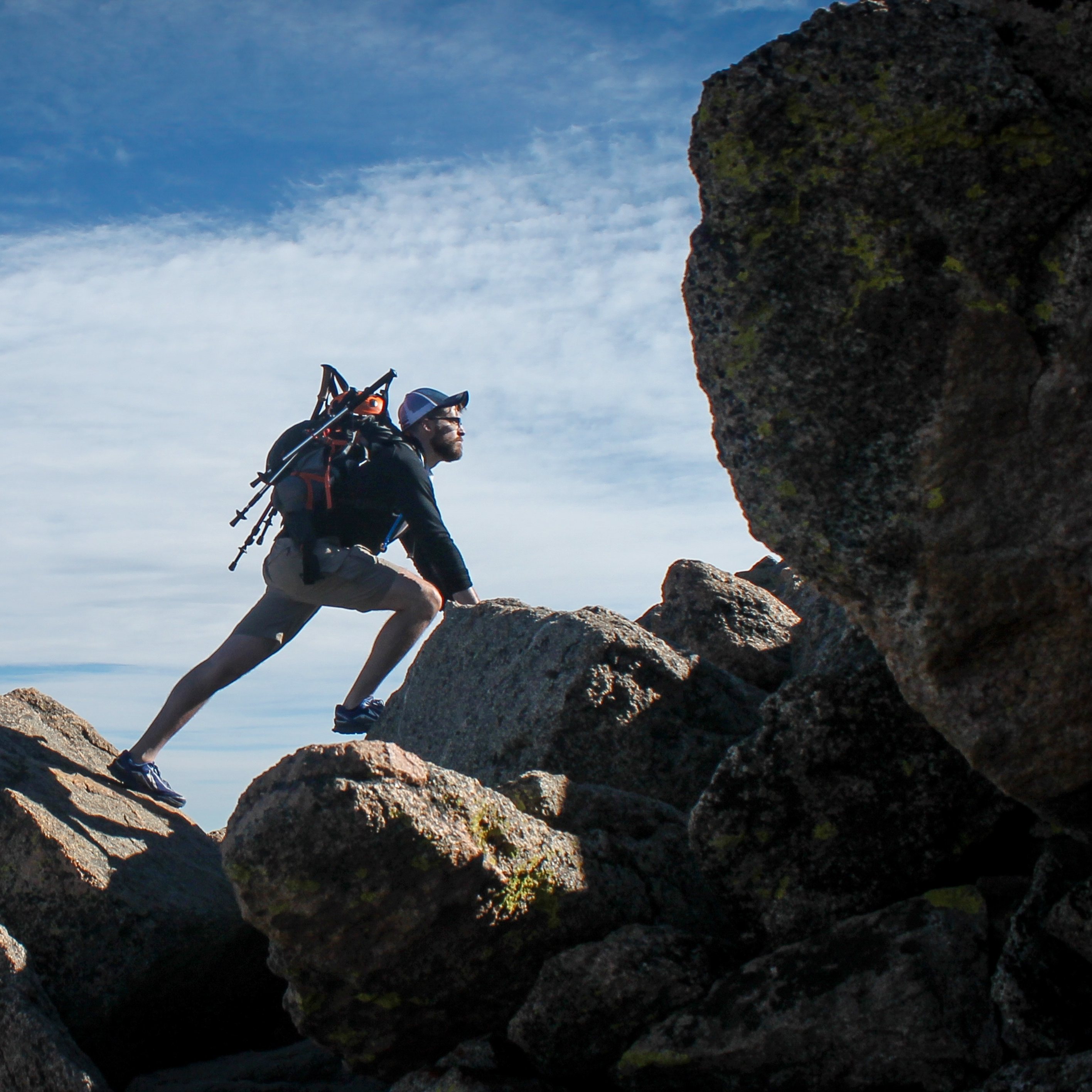 Man climbing a mountain