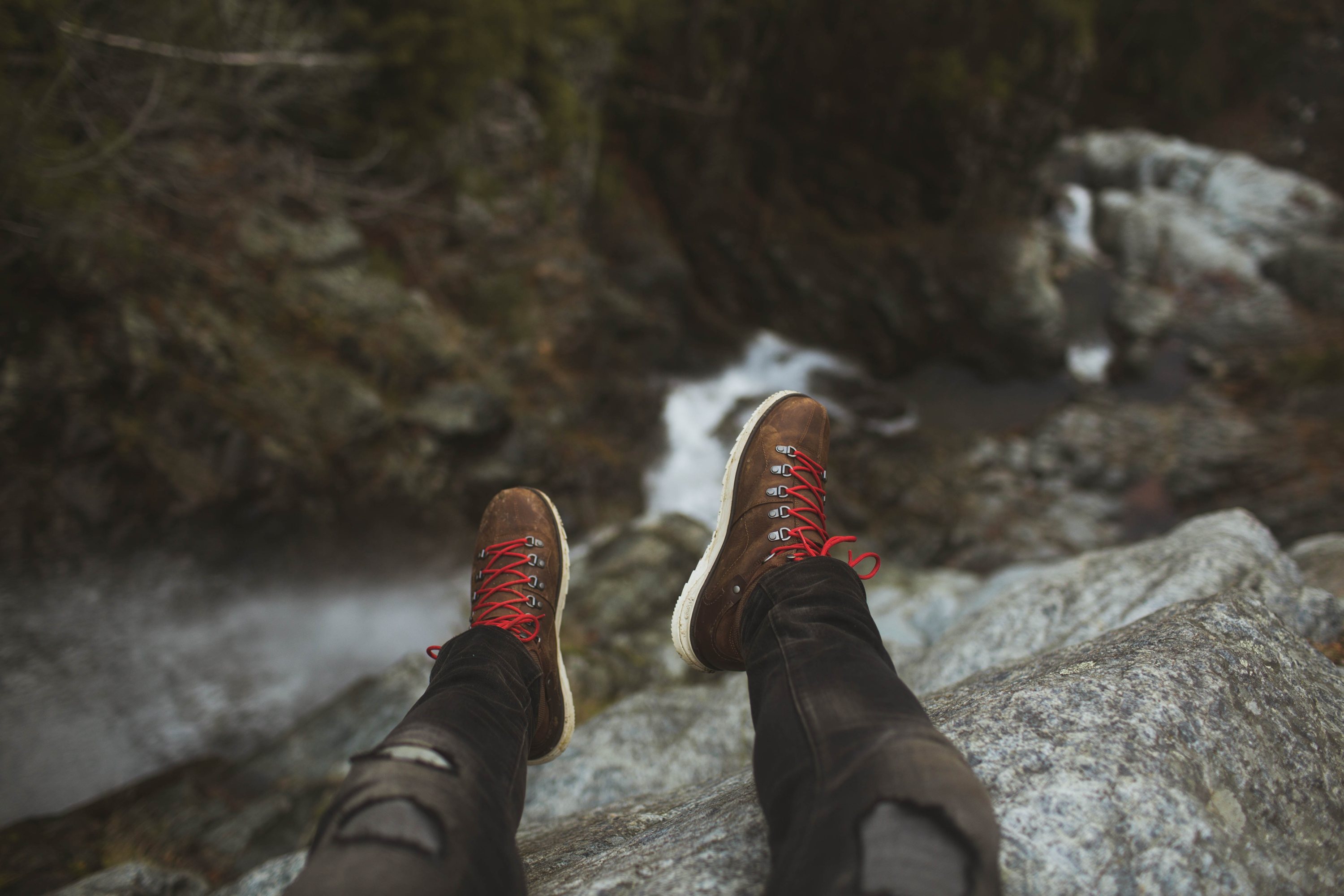 Feet hanging over cliff