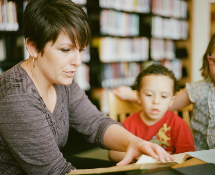 Woman and child in a library