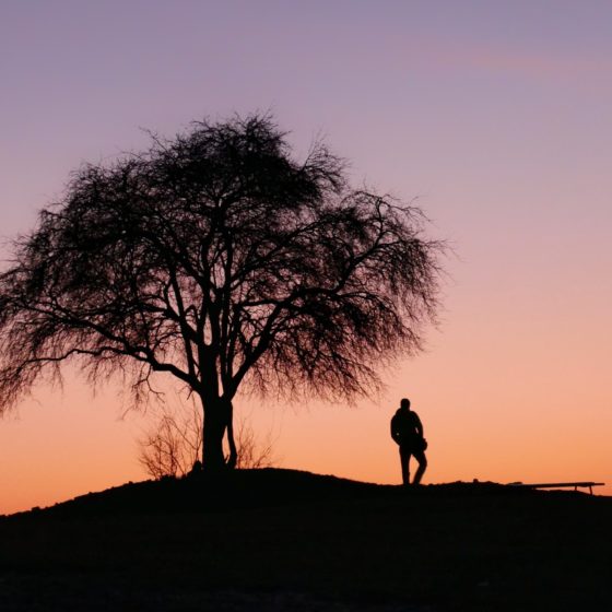 Man next to a tree