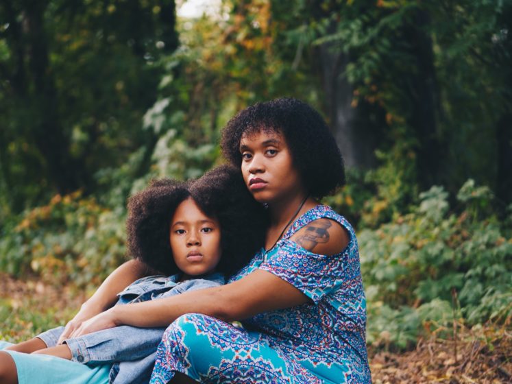 Mother and daughter in the woods