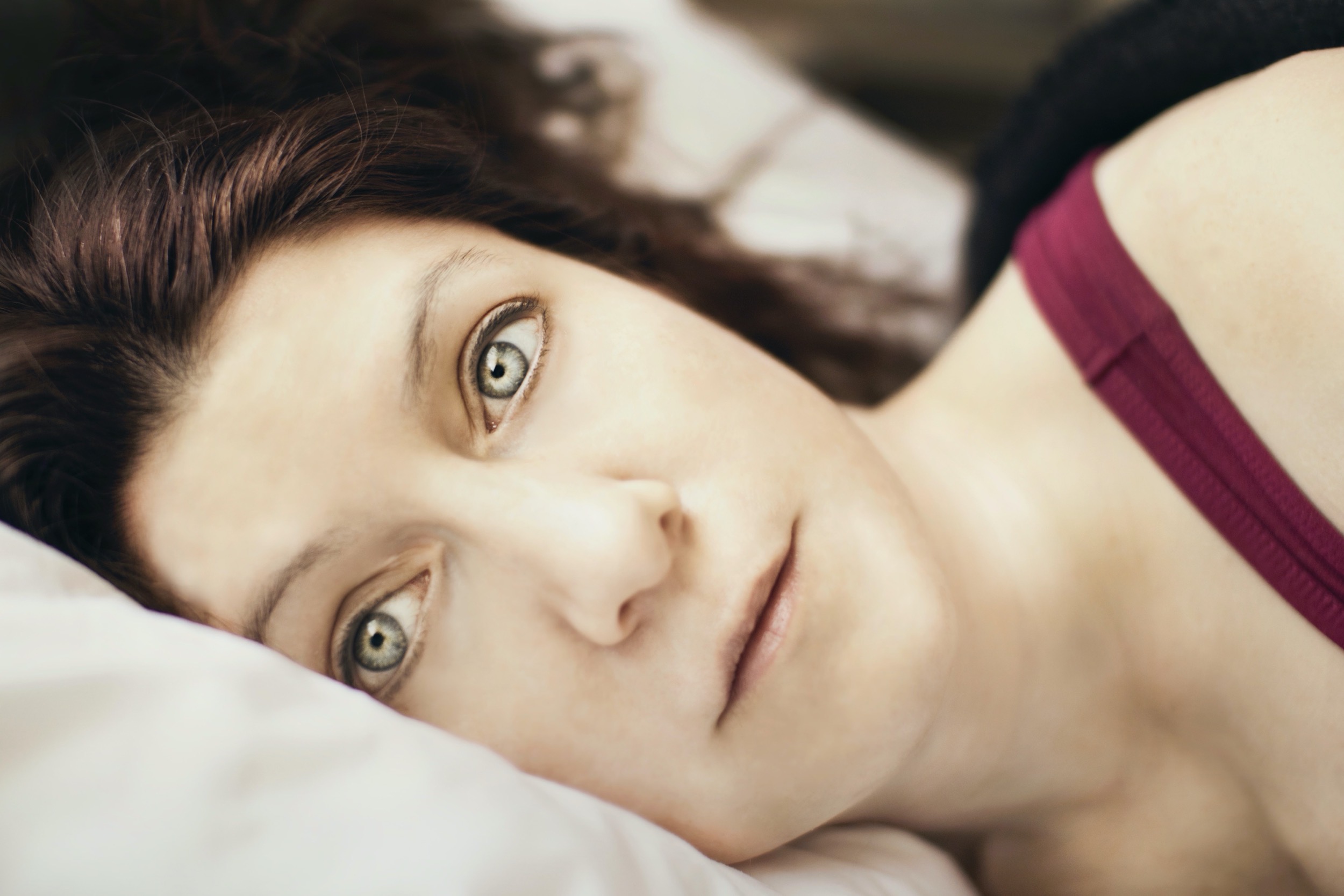 Woman's face lying on a pillow