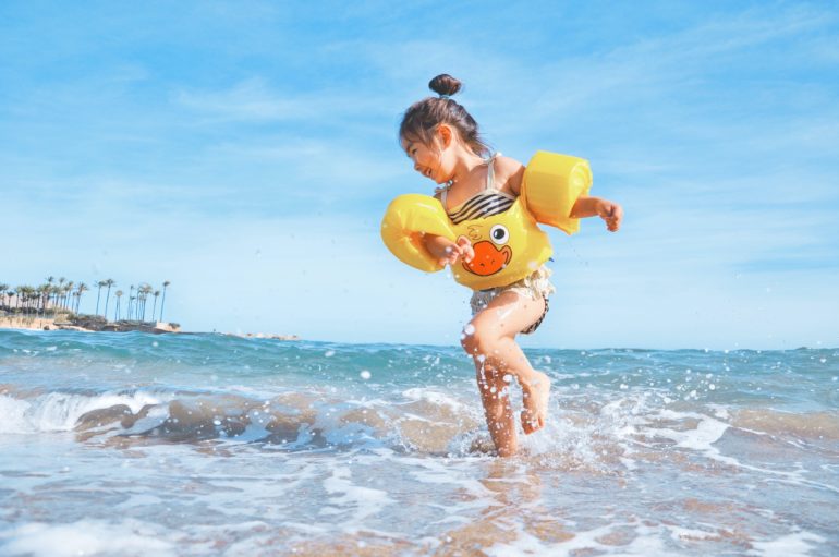 Child playing at the beach