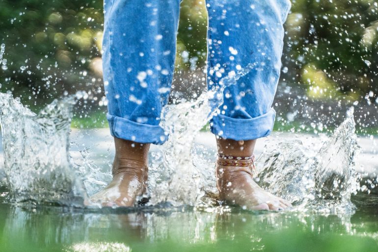 Feet splashing in water