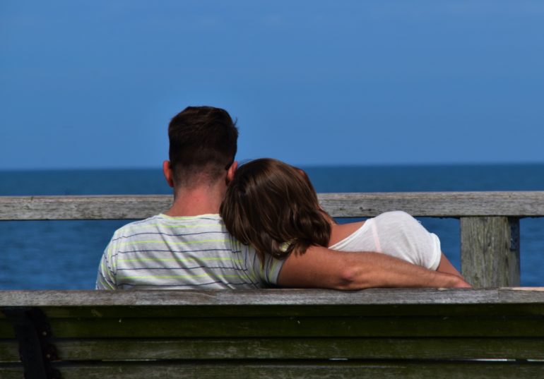 Couple sitting on a bench