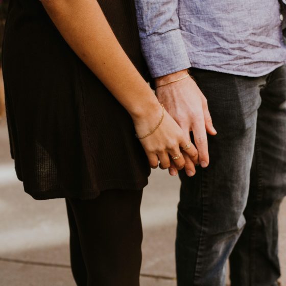 Couple holding hands