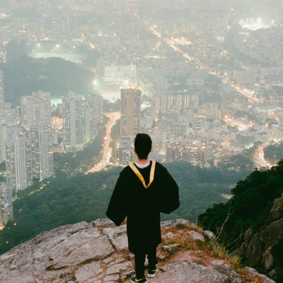 Graduate looking at city