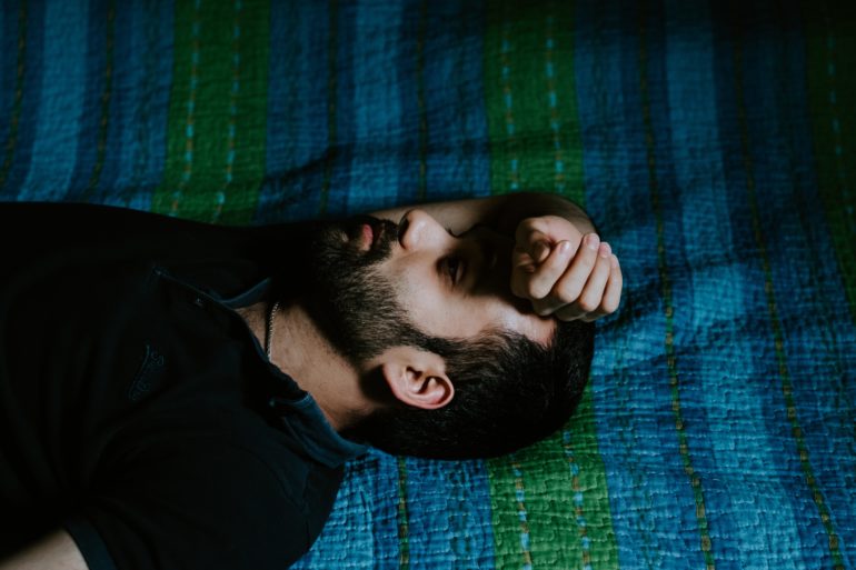 Man lying on bed