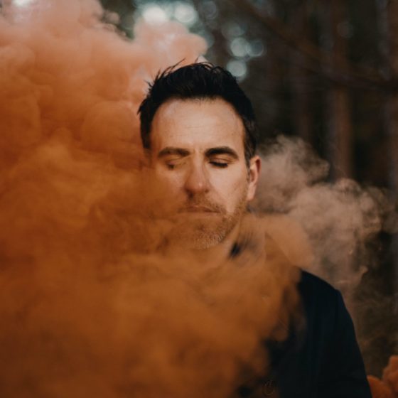 Man surrounded by smoke