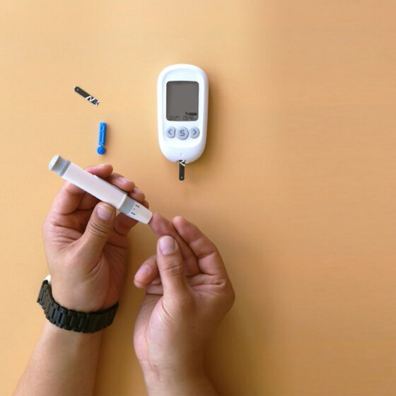 Person measuring their blood glucose level with a device