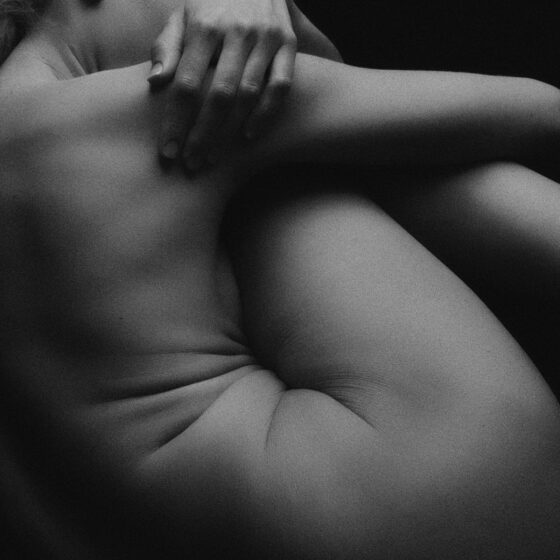 Grayscale photo of naked body